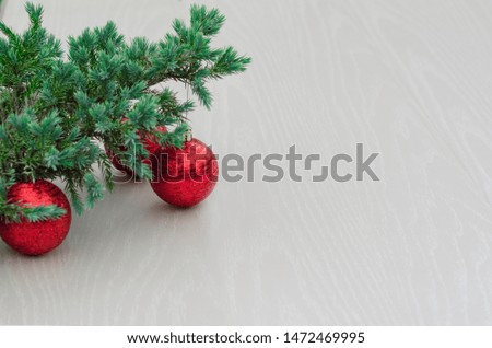 new year concept. Christmas trees with red balls, Christmas decorations on a light white  background. Christmas composition and decoration. copy space, mock up, text.
