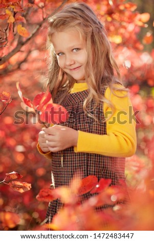 Fashionable girl child in the fall. 