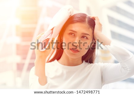 women worry about hot strong sunlight problem with UV rays to make freckles and wrinkles damage face skin  Royalty-Free Stock Photo #1472498771