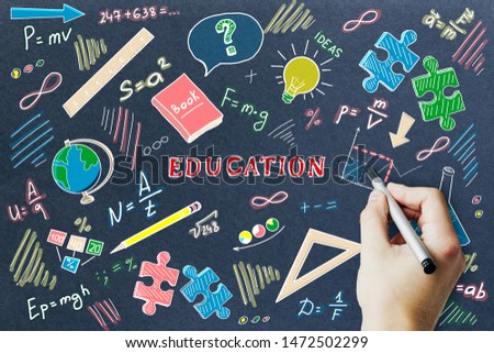 Hand drawn education sketch on dark wall background. Knowledge and science concept 