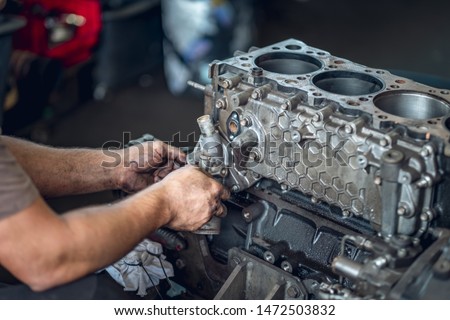 Diesel engine during service repair by a qualified mechanic Royalty-Free Stock Photo #1472503832