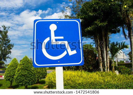 Traffic signs, wheelchair parking in the park.