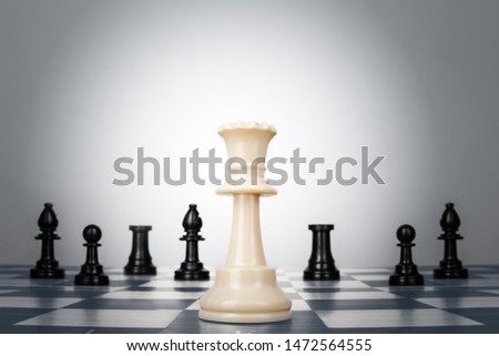 One chess pieces staying against thel set of chess pieces. Strategy, business concept