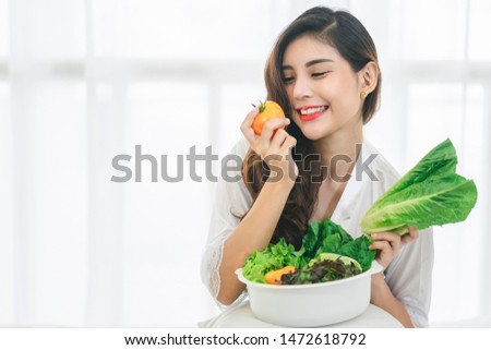Beautiful Asian woman with healthy food. Heathy life style and Beautiful skin care food concept. Royalty-Free Stock Photo #1472618792