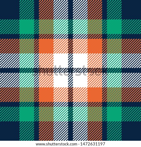 Seamless plaid pattern vector background. Multicolored dark tartan check plaid in blue, green, orange, and white for poncho, throw, blanket, or other modern fashion or home textile design.