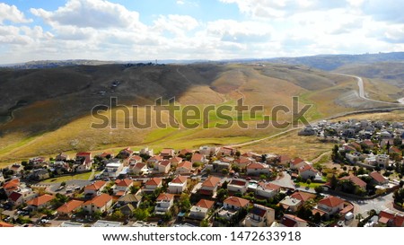 Small town with red rooftops Close to the desert Aerial view
Drone shot of Houses Close to the desert in Israel city of Maale adumim
 Royalty-Free Stock Photo #1472633918