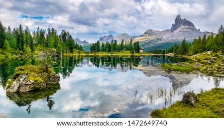 Amazing Lago Di Federa See with beautiful reflection. Majestic Landscape with Dolomites peak, Cortina D'Ampezzo, South Tyrol, Dolomites, Italy. Travel in nature. Travel concept. Beauty world. Panorama Royalty-Free Stock Photo #1472649740
