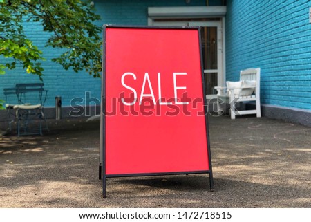 Sale sign near shop door. Mock up advertise display frame setting for shopping, business fashion and advertisement concept