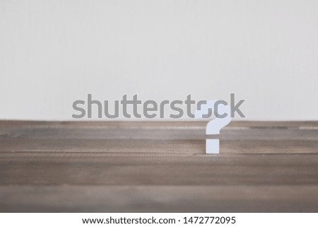 Question mark on wood table , Problem Concept