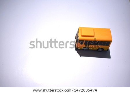 Yellow bus toys for kids isolated on white background