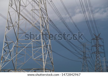 High-voltage electric poles and high-voltage cables.