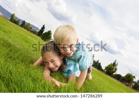 Happy laughing Kids Playing Outdoors