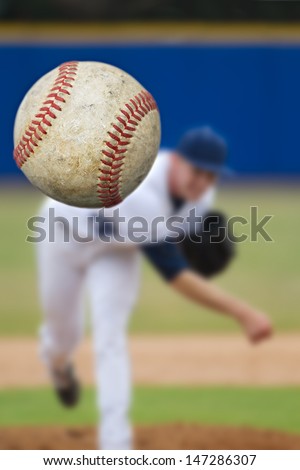 Baseball Pitcher Throwing focus on Ball