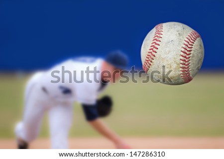 Baseball Pitcher Throwing ball, selective focus Royalty-Free Stock Photo #147286310