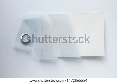 card wirh ring and light blue ribbon