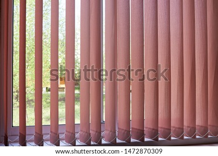 Modern vertical blinds on the window of the office