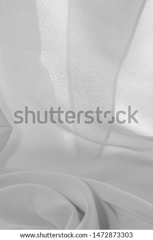 texture background pattern. White silk fabric with a subtle matte sheen. It is perfect for your design, accents, wallpapers, posters and postcards.