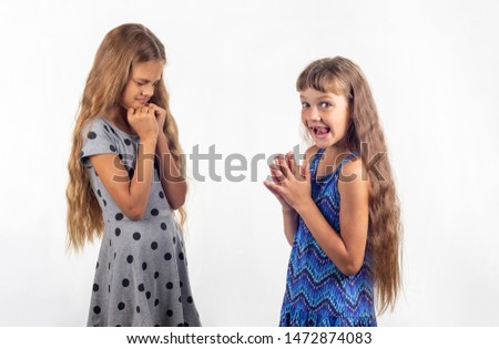 Girl comes up with a punishment for her friend for arguing argument Royalty-Free Stock Photo #1472874083