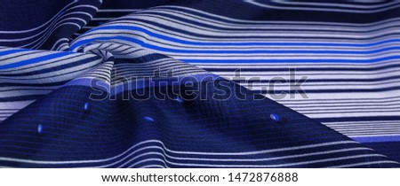 Texture, pattern, collection, silk fabric, blue background with a striped pattern of white and purple lines, the Spanish theme, which is great for the design of procedures and projects.