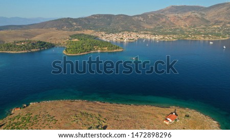 Aerial drone photo from picturesque islet of Agios Georgios featurinf small chapel, Galaxidi village, Greece