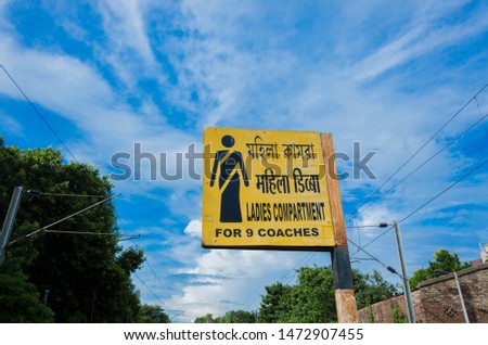 Sign board for ladies compartment on railway platform