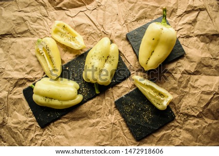 Pepper. Yellow peppers. Old paper background.