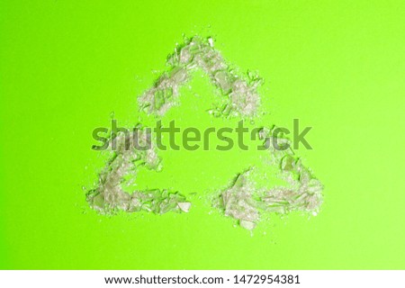 reuse sign on green background