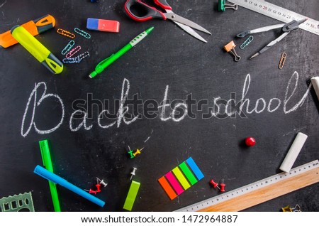back to school written on a black chalk black board