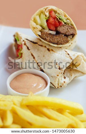 Meatball Wrap with sause and fried potatoes