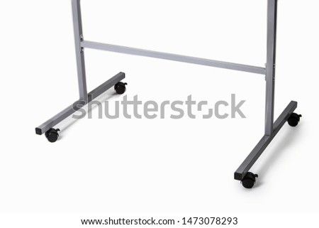 Floor legs from rack hanger or flipchart with four castors. 