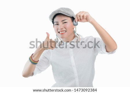 Pictures of Asian women are happy and smiling when holding the car keys. On  white background, Focus on the face.