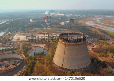 Chernobyl nuclear power plant. Cooling tower overlooking the nuclear power plant in Chernobyl. View of the destroyed nuclear power plant. Chernobyl nuclear power plant, Ukrine. Aerial view. Royalty-Free Stock Photo #1473106520