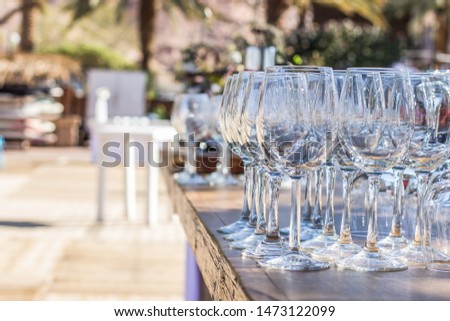 outdoor bar counter with perspective empty glasses dish for drinks, some event exterior wallpaper pattern picture, empty copy space 