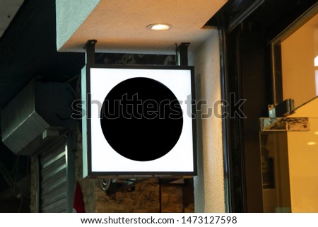 White black square signboard on the wooden wall.3d rendering mockup