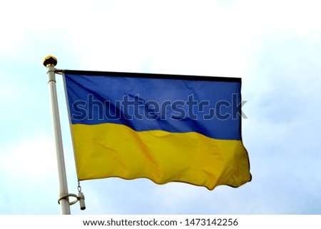 Flag of Ukraine waving in the wind with yellow and blue horizontal stripes
