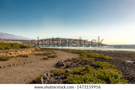 A footpath along Playa del Cabezo beach near El Medano town, Tenerife, Spain
