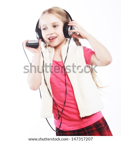 dancing little blond girl headphones music singing on white background 