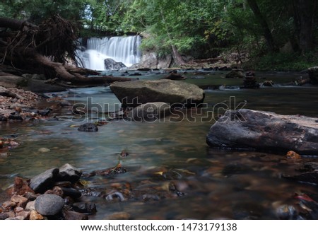 Long Exposure with Smooth Water and Surrounding Green Foliage