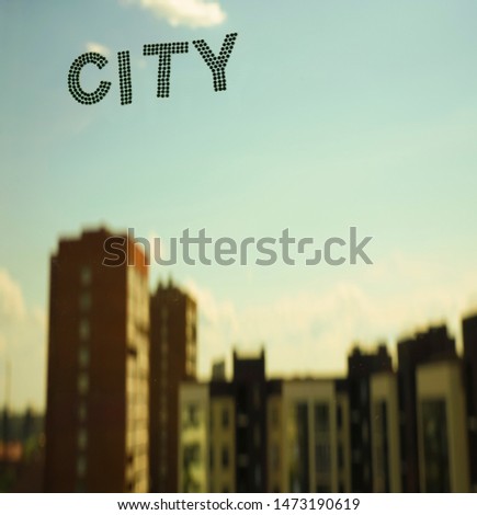 word - city on blue sky and highrise buildings background. 