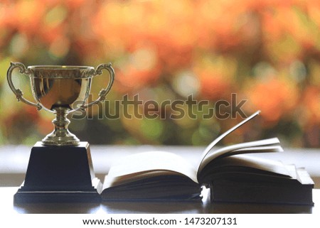 Close-up of trophies multicolored light as background selective focus and shallow depth of field