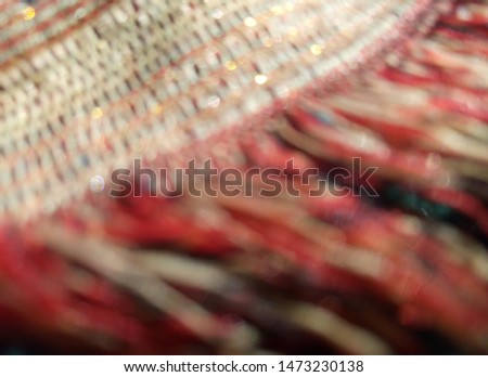 blurred background and bokeh woven yarn and tassel tapestry