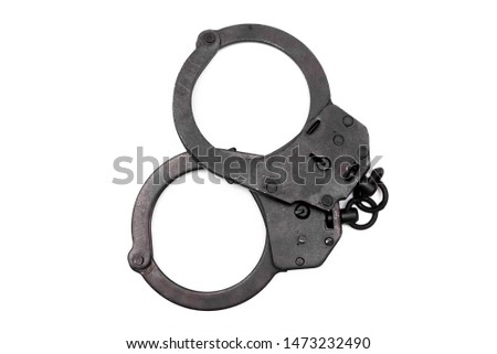 Black handcuffs isolated on the white background.