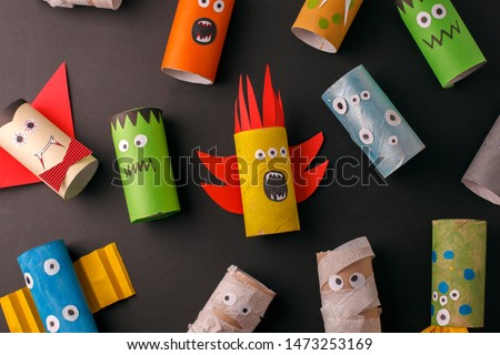 Collection of Monsters from toilet tube roll for halloween decor. A terrible craft. School and kindergarten. Handcraft creative idea, seasonal autumn holiday pattern