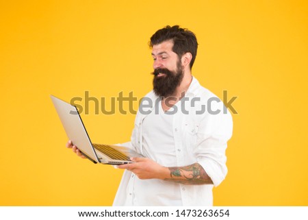 Digital world. Programming concept. Bearded man with notebook. Successful developer. Online shopping. Programmer with laptop. Surfing internet. Online payment. Online purchase. Man using notebook.