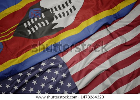 waving colorful flag of united states of america and national flag of swaziland. 