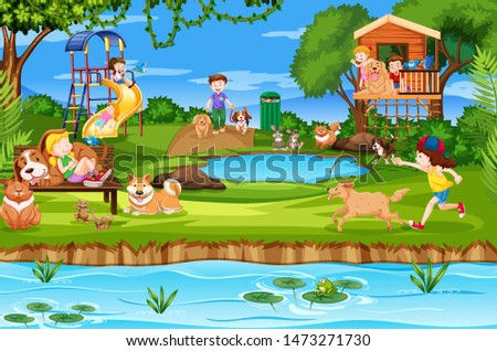 Children and friends playing in a park with pet dog and cat