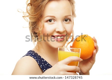 Woman holding orange and  juice over white
