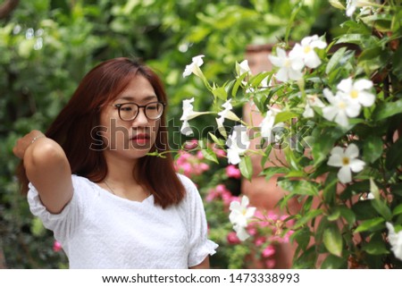 Asian woman pose with a green nature or taking portrait  
