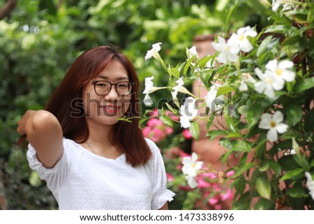 Asian woman pose with a green nature or taking portrait  