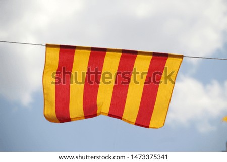 Official flag of Aragon waving in the air